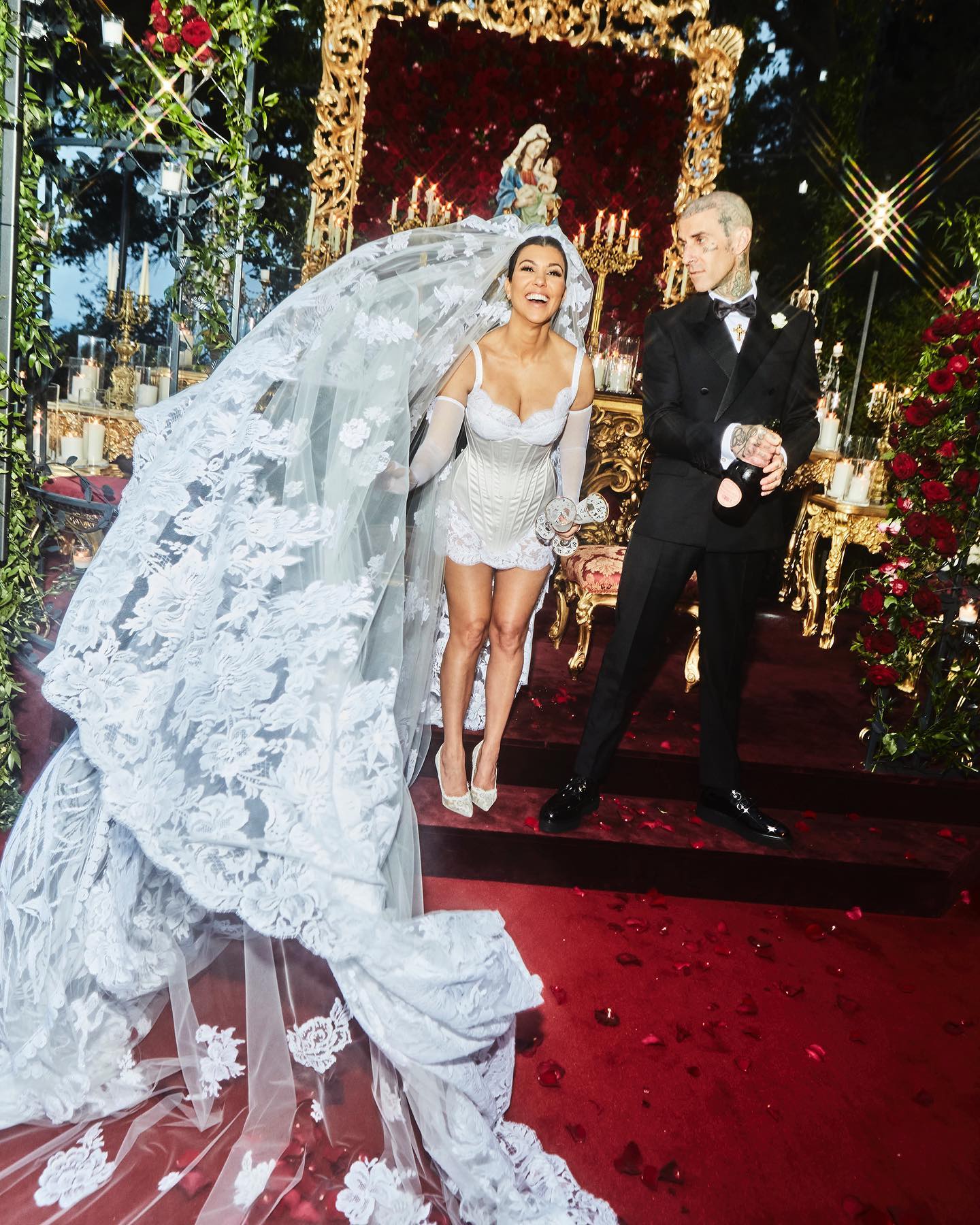Kourtney Kardashian and Travis Barker at the alter on their wedding day